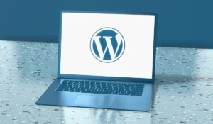 laptop showing wordpress written